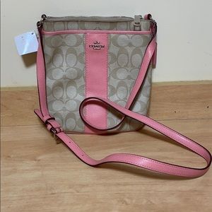 Brand new Coach Crossbody bag with pink leather Originally $155.